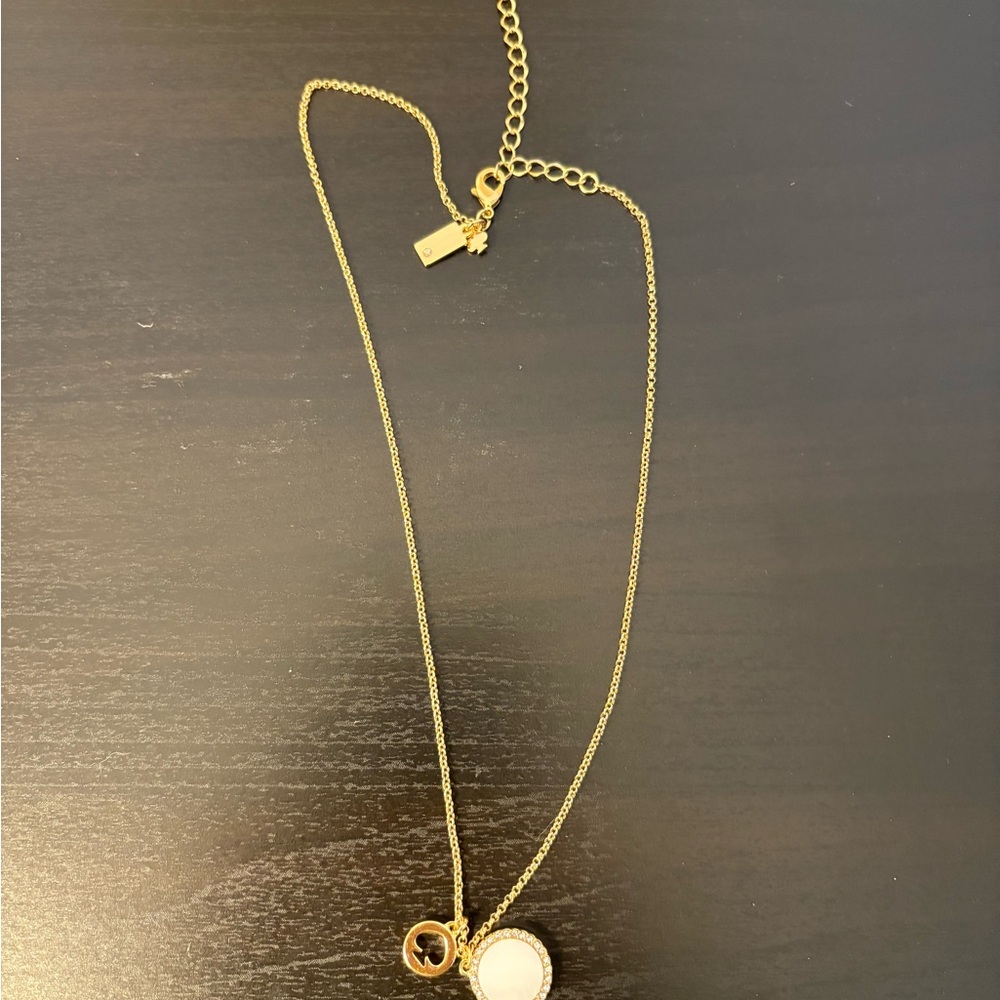 Kate Spade Elegant Gold and White Pendant Necklace